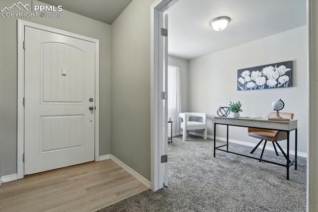 7791 Berwyn Loop, Peyton, CO 80831 - foyer entrance featuring baseboards and wood finished floors