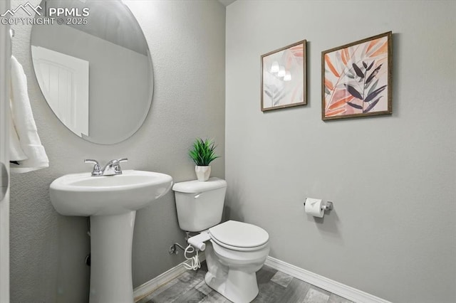 7791 Berwyn Loop, Peyton, CO 80831 - bathroom with toilet and wood finished floors