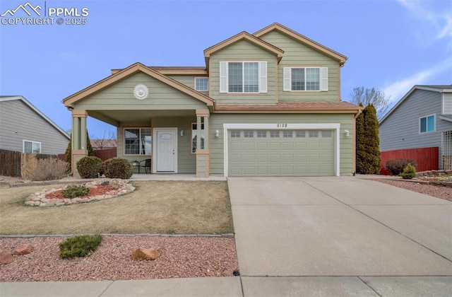 5128 Mountain Air Cir, Colorado Springs, CO 80916 - view of front of house featuring covered porch, an attached garage, and driveway