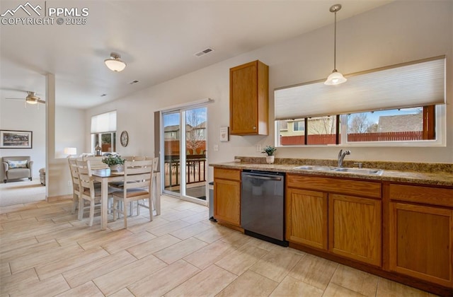 5128 Mountain Air Cir, Colorado Springs, CO 80916 - kitchen featuring stainless steel dishwasher, brown cabinets, hanging light fixtures, and a ceiling fan