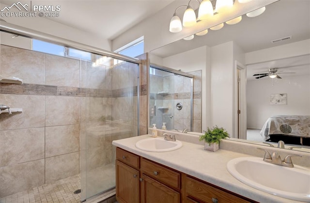 5128 Mountain Air Cir, Colorado Springs, CO 80916 - ensuite bathroom with double vanity, a stall shower, and ceiling fan