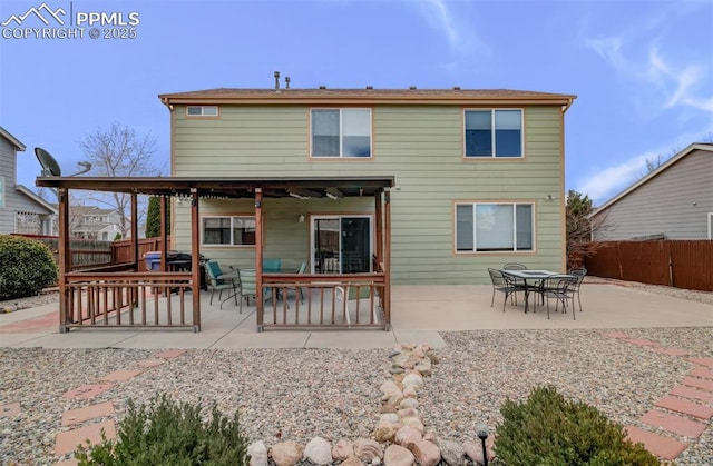 5128 Mountain Air Cir, Colorado Springs, CO 80916 - back of house featuring a patio, a fenced backyard, and outdoor dining space