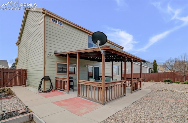 5128 Mountain Air Cir, Colorado Springs, CO 80916 - rear view of property featuring a patio area, a gate, and a fenced backyard