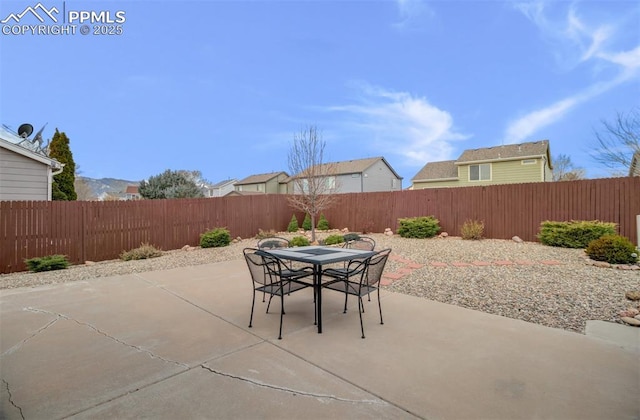 5128 Mountain Air Cir, Colorado Springs, CO 80916 - fenced backyard with a patio and outdoor dining space