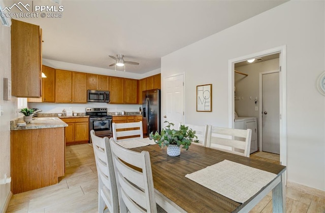 5128 Mountain Air Cir, Colorado Springs, CO 80916 - dining room with separate washer and dryer and a ceiling fan