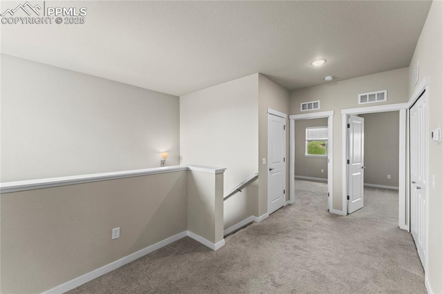5489 Passport Vw, Colorado Springs, CO 80922 - corridor with an upstairs landing, carpet flooring, and recessed lighting