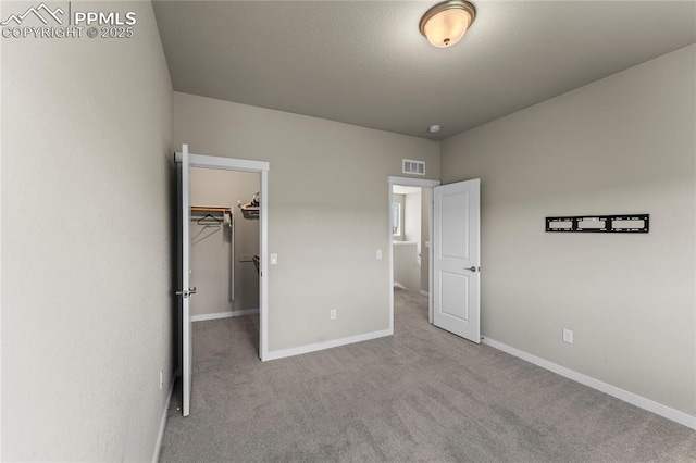 5489 Passport Vw, Colorado Springs, CO 80922 - unfurnished bedroom with carpet floors and a spacious closet