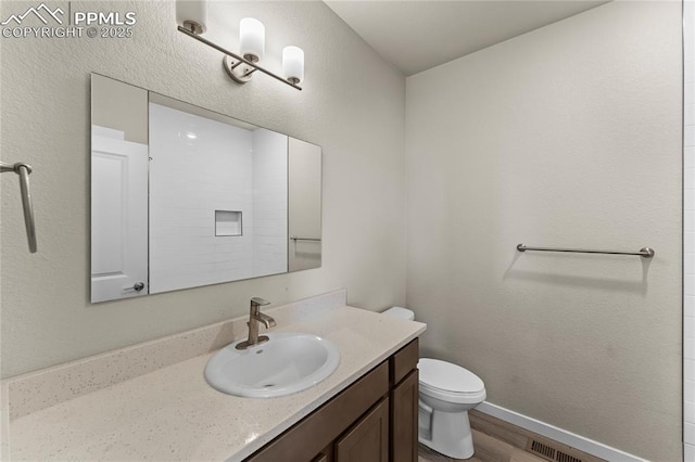 5489 Passport Vw, Colorado Springs, CO 80922 - bathroom featuring vanity and wood finished floors