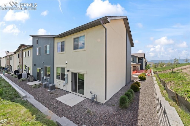 5489 Passport Vw, Colorado Springs, CO 80922 - back of property featuring stucco siding, a residential view, and a patio