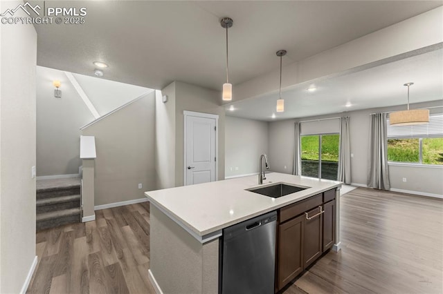 5489 Passport Vw, Colorado Springs, CO 80922 - kitchen featuring dishwasher, light wood finished floors, open floor plan, light countertops, and recessed lighting