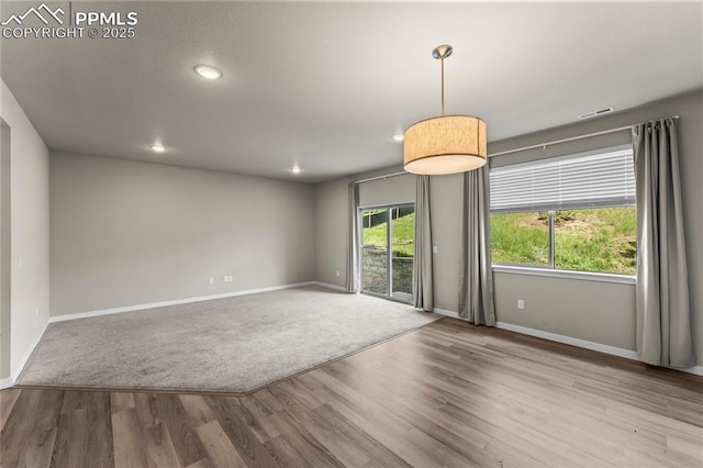 5489 Passport Vw, Colorado Springs, CO 80922 - unfurnished room featuring wood finished floors and recessed lighting