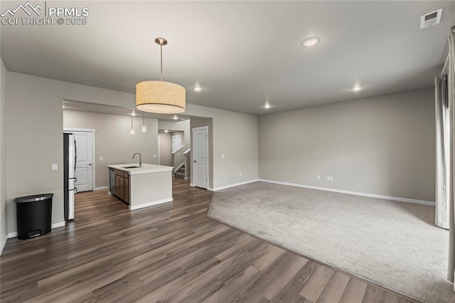 5489 Passport Vw, Colorado Springs, CO 80922 - unfurnished living room with stairway, dark wood-type flooring, and recessed lighting