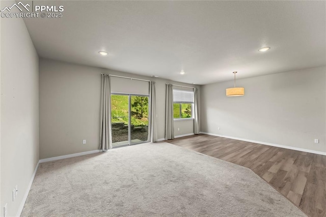 5489 Passport Vw, Colorado Springs, CO 80922 - unfurnished room featuring recessed lighting, carpet flooring, and wood finished floors