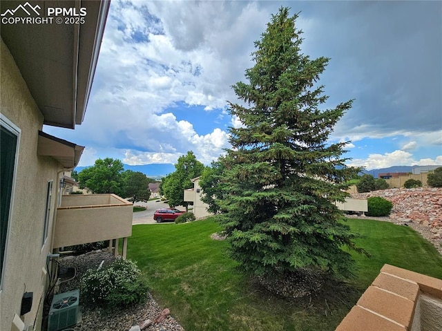 2114 Summerset Dr, Colorado Springs, CO 80920 - view of grassy yard featuring a balcony