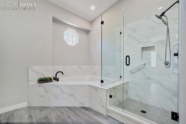 5115 Vista Del Norte Pt, Colorado Springs, CO 80919 - full bath featuring a garden tub, a marble finish shower, and wood finished floors