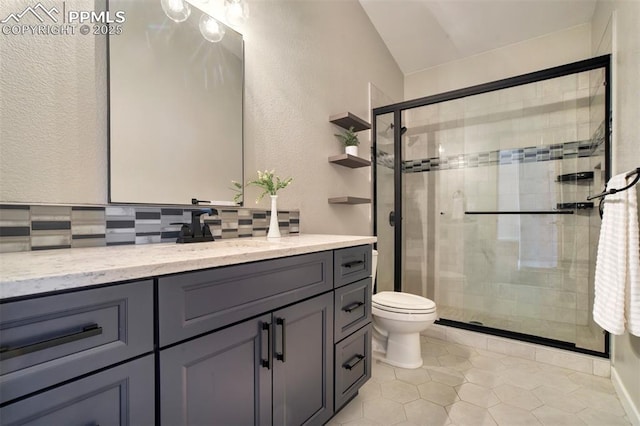 5115 Vista Del Norte Pt, Colorado Springs, CO 80919 - bathroom featuring backsplash, vanity, a shower stall, a textured wall, and tile patterned floors