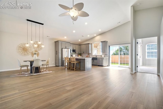 5115 Vista Del Norte Pt, Colorado Springs, CO 80919 - living area featuring high vaulted ceiling, light wood-style floors, ceiling fan, and recessed lighting