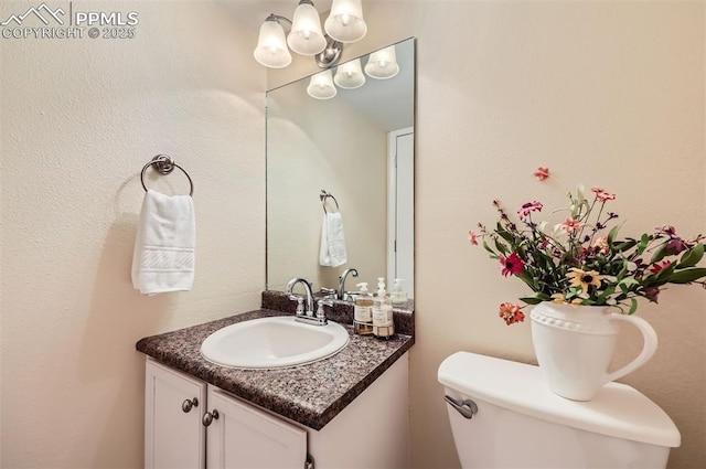 2512 Elite Ter, Colorado Springs, CO 80920 - bathroom featuring vanity and a chandelier