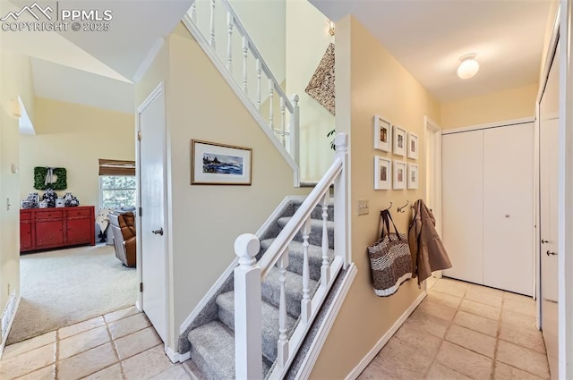 2512 Elite Ter, Colorado Springs, CO 80920 - stairs featuring carpet flooring and tile patterned flooring
