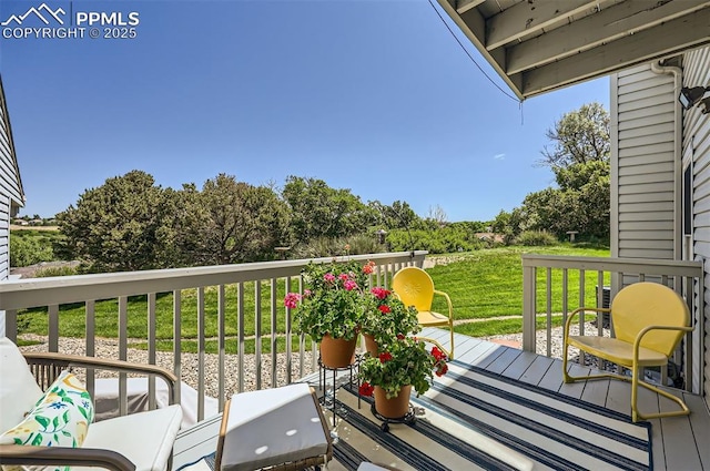 2512 Elite Ter, Colorado Springs, CO 80920 - view of wooden balcony featuring a deck
