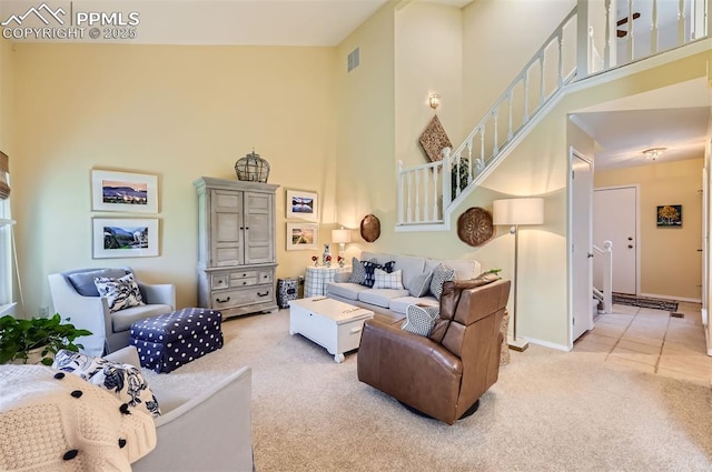 2512 Elite Ter, Colorado Springs, CO 80920 - carpeted living room with a towering ceiling and stairs