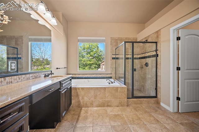 1117 Spectrum Loop, Colorado Springs, CO 80921 - full bath with vanity, a stall shower, a bath, and plenty of natural light