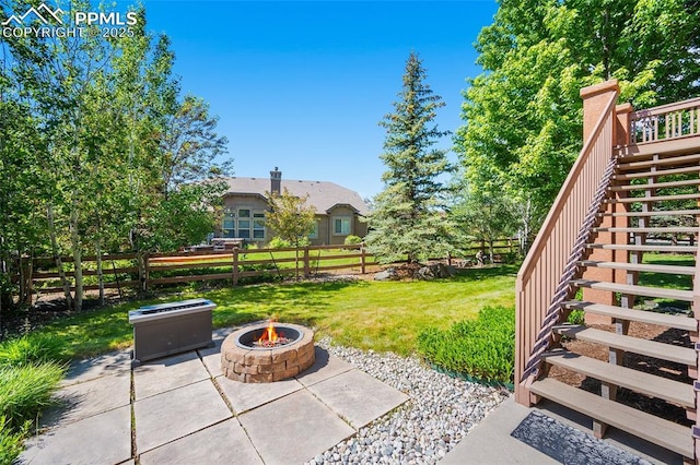 1117 Spectrum Loop, Colorado Springs, CO 80921 - view of yard with stairs, a fire pit, and a patio area