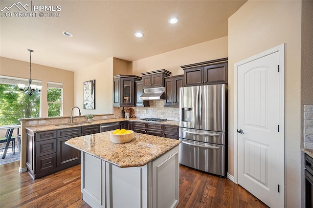1117 Spectrum Loop, Colorado Springs, CO 80921 - kitchen with stainless steel appliances, a peninsula, ventilation hood, dark wood-style flooring, and recessed lighting