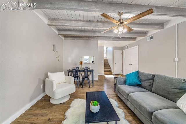 3210 Van Teylingen Dr Unit E, Colorado Springs, CO 80917 - living room with stairway, a ceiling fan, wood finished floors, and a wooden ceiling with exposed beams