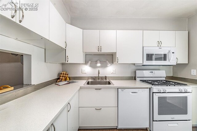 3210 Van Teylingen Dr Unit E, Colorado Springs, CO 80917 - kitchen featuring white appliances, white cabinets, and light countertops