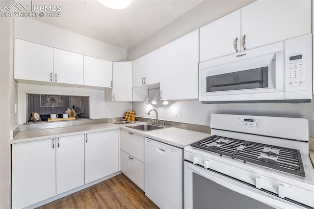 3210 Van Teylingen Dr Unit E, Colorado Springs, CO 80917 - kitchen with white appliances, light countertops, dark wood-style flooring, and white cabinetry