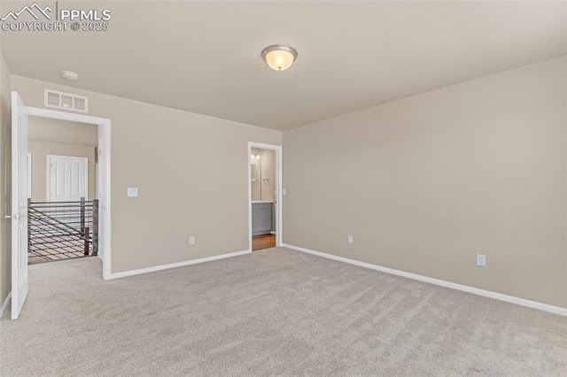 6211 Godwit Ln, Colorado Springs, CO 80925 - carpeted empty room with baseboards and a smoke detector