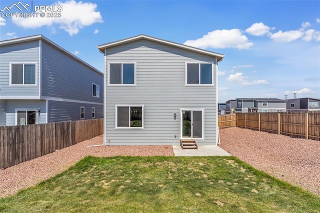 6211 Godwit Ln, Colorado Springs, CO 80925 - rear view of house featuring a fenced backyard and a patio