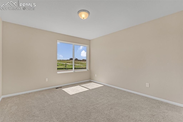 6211 Godwit Ln, Colorado Springs, CO 80925 - carpeted empty room with baseboards