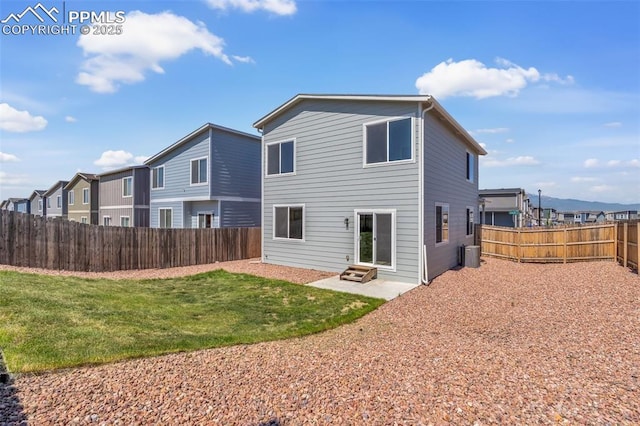 6211 Godwit Ln, Colorado Springs, CO 80925 - rear view of house featuring a fenced backyard