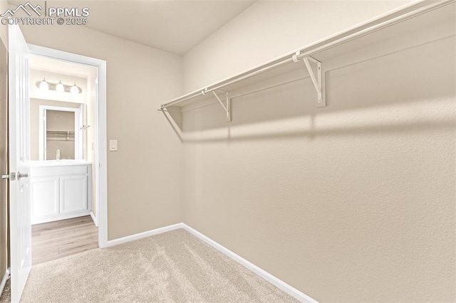 6211 Godwit Ln, Colorado Springs, CO 80925 - spacious closet featuring carpet floors