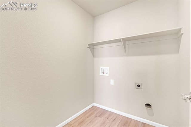 6211 Godwit Ln, Colorado Springs, CO 80925 - laundry area featuring washer hookup, light wood-type flooring, and electric dryer hookup