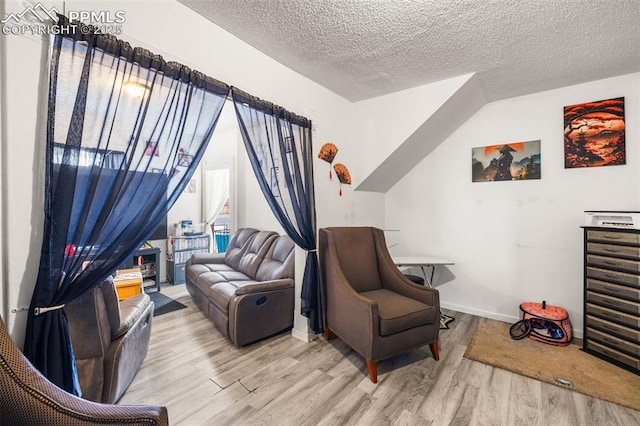 609 W 8th St Unit 611, Pueblo, CO 81003 - living area with wood finished floors and a textured ceiling
