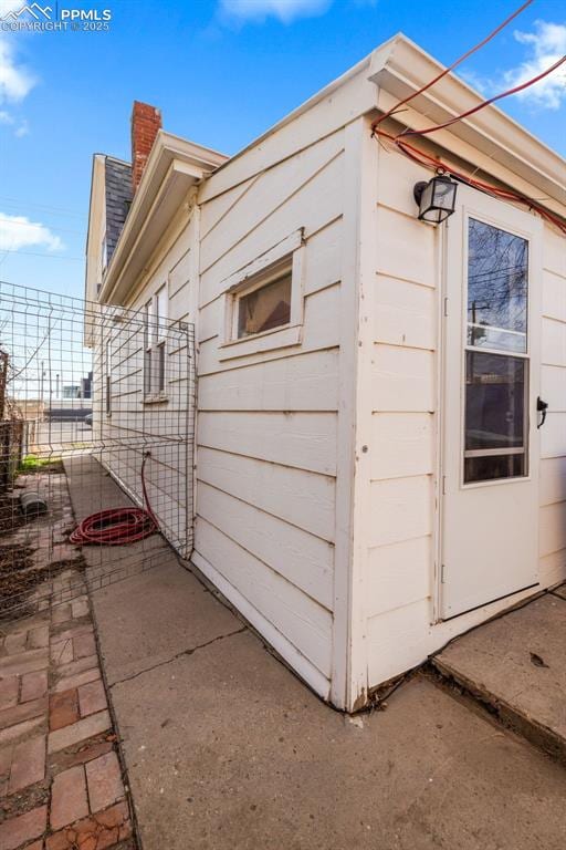 609 W 8th St Unit 611, Pueblo, CO 81003 - view of side of home featuring a chimney