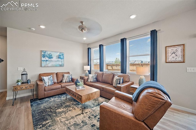8082 Goldenray Pl, Colorado Springs, CO 80908 - living area with ceiling fan, light wood finished floors, recessed lighting, and a textured ceiling