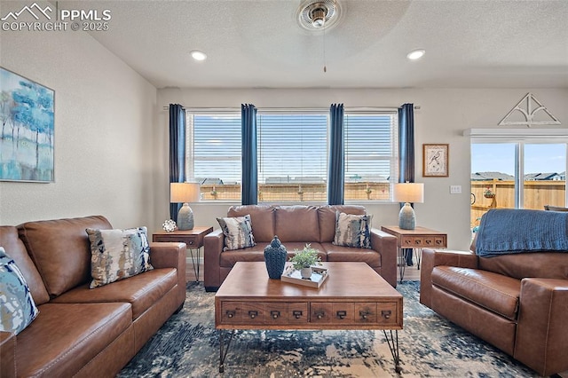 8082 Goldenray Pl, Colorado Springs, CO 80908 - living room with a textured ceiling, recessed lighting, and ceiling fan