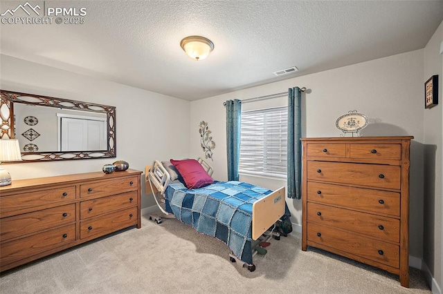 8082 Goldenray Pl, Colorado Springs, CO 80908 - bedroom featuring light carpet and a textured ceiling