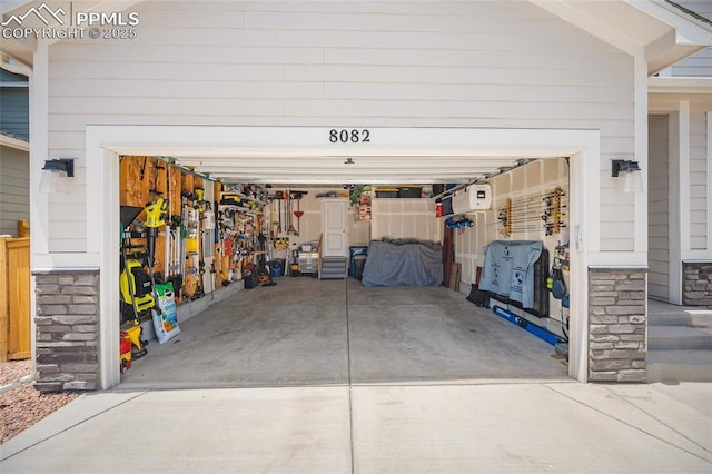 8082 Goldenray Pl, Colorado Springs, CO 80908 - garage with concrete driveway