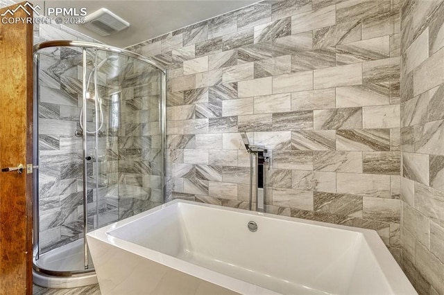 2533 Bennett Ave, Colorado Springs, CO 80909 - bathroom with a garden tub and a shower stall