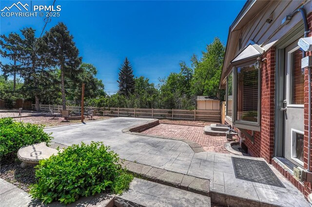 2533 Bennett Ave, Colorado Springs, CO 80909 - fenced backyard featuring a patio area