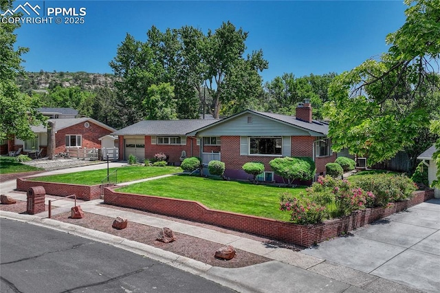 2533 Bennett Ave, Colorado Springs, CO 80909 - single story home with an attached garage, a chimney, a front lawn, driveway, and brick siding