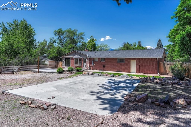 2533 Bennett Ave, Colorado Springs, CO 80909 - ranch-style home featuring brick siding and a patio