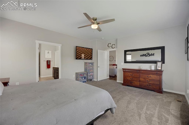 10076 Oro Belle Ct, Colorado Springs, CO 80924 - carpeted bedroom with a ceiling fan and ensuite bath