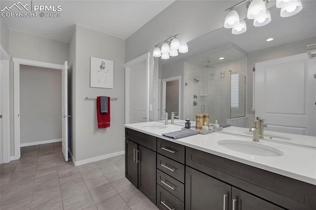 10076 Oro Belle Ct, Colorado Springs, CO 80924 - full bath with double vanity, a shower stall, tile patterned floors, and a chandelier