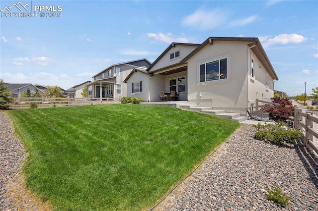 10076 Oro Belle Ct, Colorado Springs, CO 80924 - rear view of property featuring stucco siding and a patio area